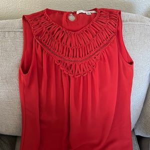 Women’s chiffon dress. Sits right below the knee, loose fit.